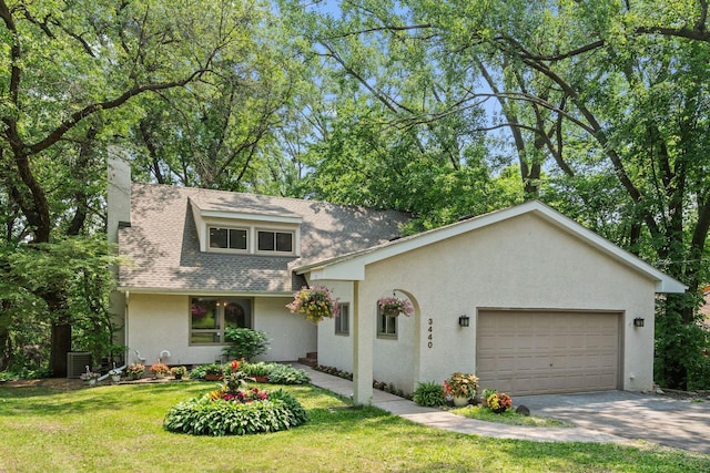 3440 Glenarden Rd, Arden Hills, MN 55112 - view of front of home with an attached garage, stucco siding, concrete driveway, a front lawn, and a chimney
