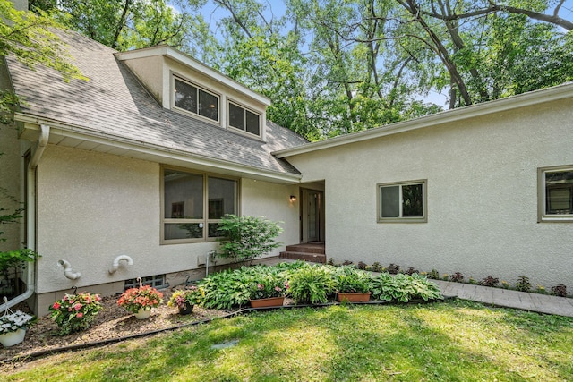3440 Glenarden Rd, Arden Hills, MN 55112 - view of front of house with roof with shingles, stucco siding, and a front yard