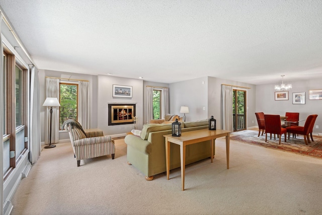 3440 Glenarden Rd, Arden Hills, MN 55112 - living area with light carpet, a textured ceiling, a chandelier, healthy amount of natural light, and a glass covered fireplace