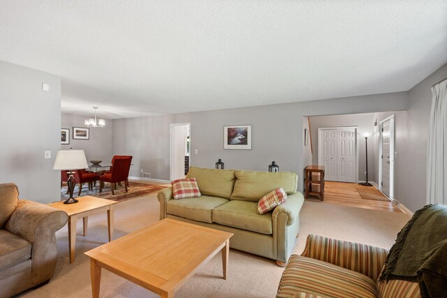 3440 Glenarden Rd, Arden Hills, MN 55112 - living area with a chandelier and light carpet
