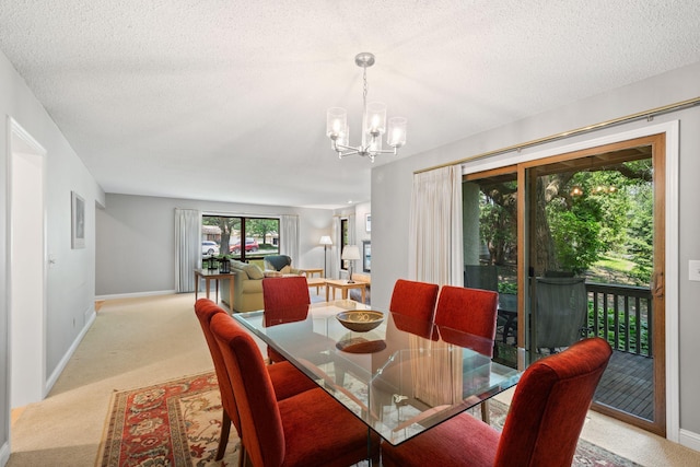 3440 Glenarden Rd, Arden Hills, MN 55112 - dining space featuring a chandelier, light carpet, and a textured ceiling
