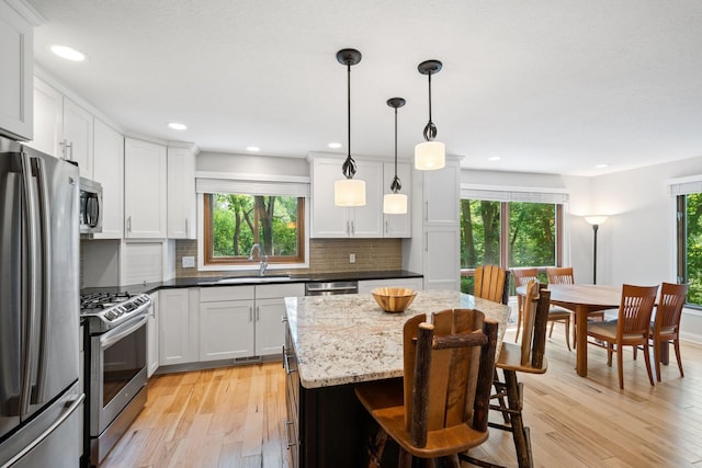 3440 Glenarden Rd, Arden Hills, MN 55112 - kitchen with stainless steel appliances, healthy amount of natural light, light wood-style flooring, and recessed lighting