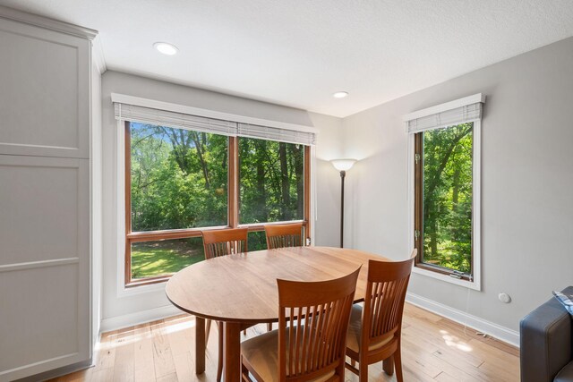 3440 Glenarden Rd, Arden Hills, MN 55112 - dining room featuring plenty of natural light, light wood-type flooring, and recessed lighting