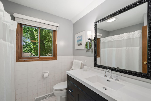 3440 Glenarden Rd, Arden Hills, MN 55112 - bathroom featuring tile walls, vanity, a wainscoted wall, and a shower with curtain