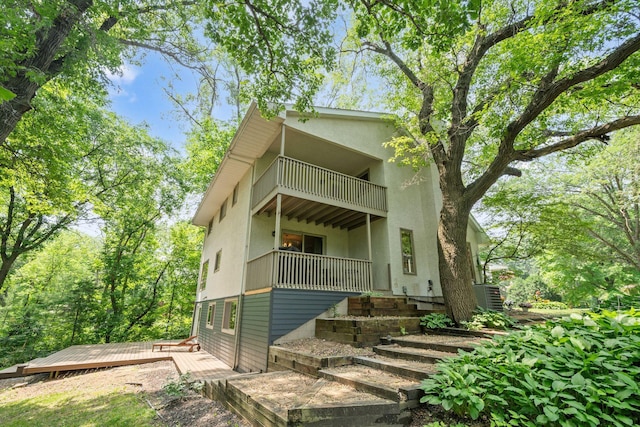 3440 Glenarden Rd, Arden Hills, MN 55112 - rear view of house featuring a balcony and stucco siding