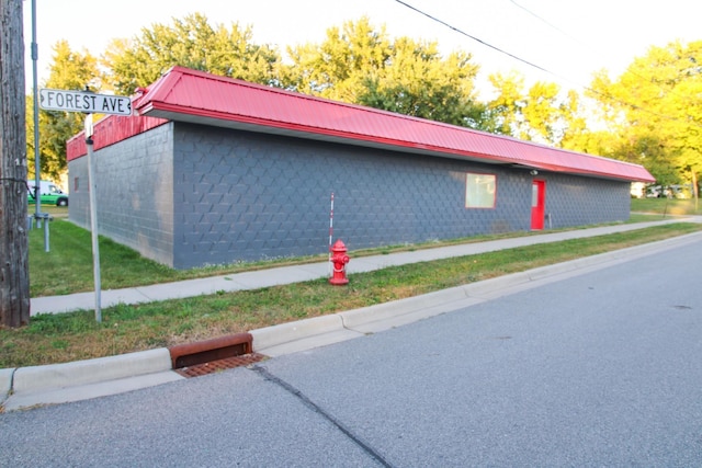 641 Forest Ave, Albany, MN 56307 - view of property exterior featuring a metal roof and concrete block siding
