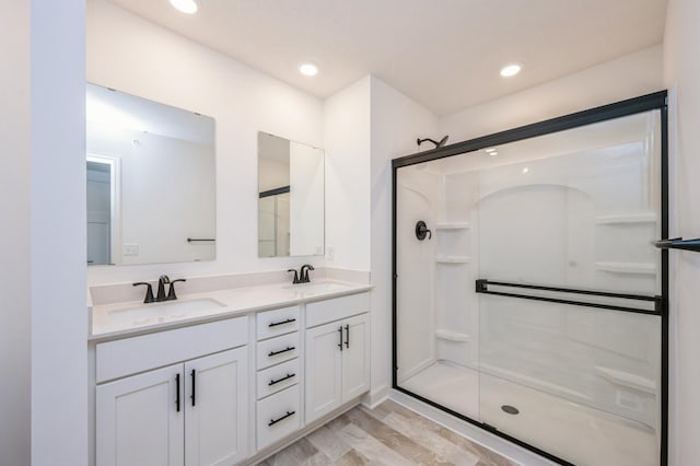 1712 Tyrone Dr, Shakopee, MN 55379 - bathroom with a stall shower, double vanity, and recessed lighting