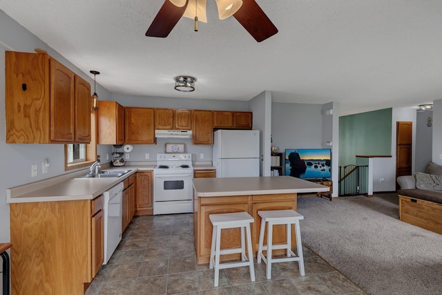 1285 Stone Ridge Rd, Sauk Rapids, MN 56379 - kitchen with white appliances, exhaust hood, open floor plan, a kitchen island, and a kitchen breakfast bar
