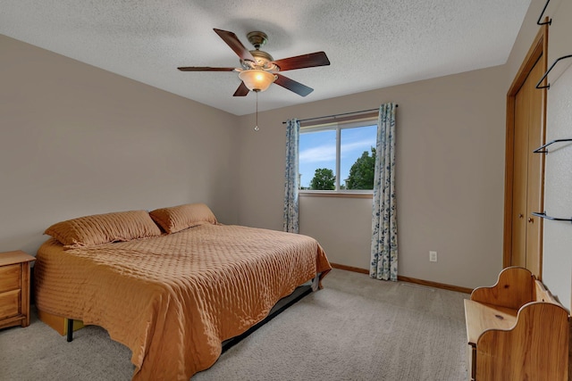 1285 Stone Ridge Rd, Sauk Rapids, MN 56379 - carpeted bedroom with ceiling fan, a textured ceiling, and baseboards