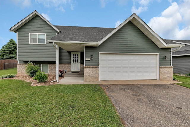 1285 Stone Ridge Rd, Sauk Rapids, MN 56379 - tri-level home with brick siding, driveway, roof with shingles, and an attached garage