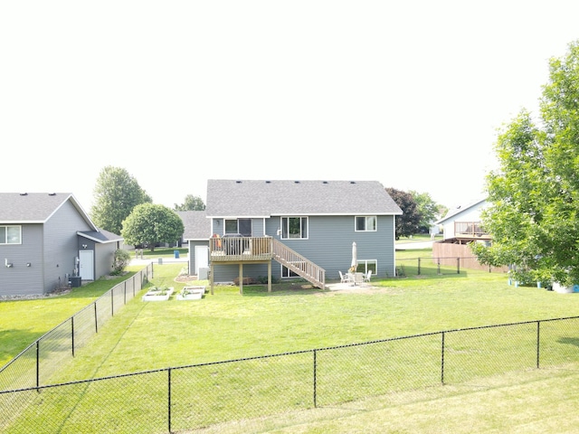 1285 Stone Ridge Rd, Sauk Rapids, MN 56379 - rear view of property featuring a deck, roof with shingles, and stairs