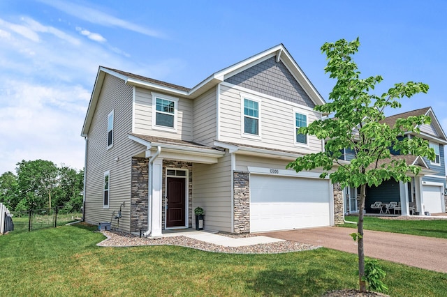 13936 146th Ave N, Dayton, MN 55327 - view of front of house featuring a garage, stone siding, and concrete driveway