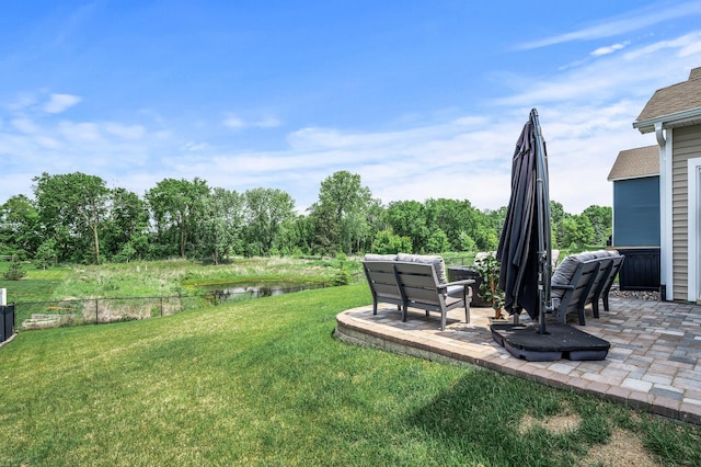13936 146th Ave N, Dayton, MN 55327 - view of green lawn featuring a patio area and a water view