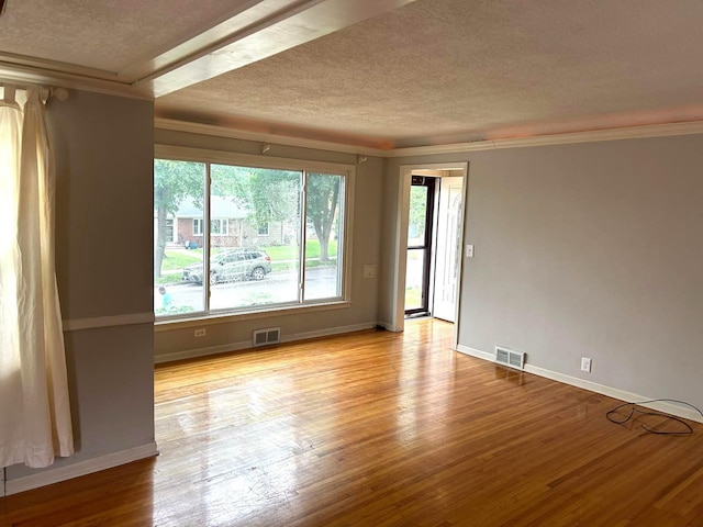3500 Abbott Ave N, Robbinsdale, MN 55422 - unfurnished room with a textured ceiling, wood finished floors, and ornamental molding