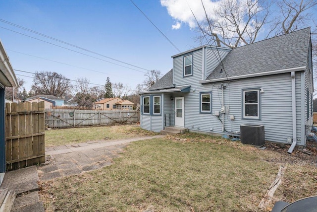3500 Abbott Ave N, Robbinsdale, MN 55422 - rear view of property featuring a shingled roof and a fenced backyard