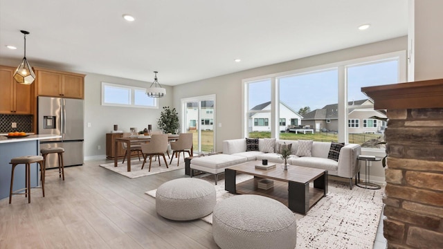 5574 130th Way N, Hugo, MN 55038 - living area with light wood-type flooring, recessed lighting, and baseboards