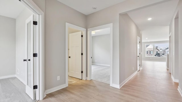 5574 130th Way N, Hugo, MN 55038 - corridor featuring light wood finished floors, baseboards, and recessed lighting