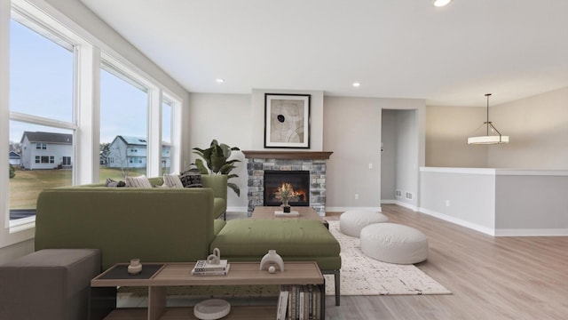 5574 130th Way N, Hugo, MN 55038 - living room with wood finished floors, baseboards, recessed lighting, and a stone fireplace
