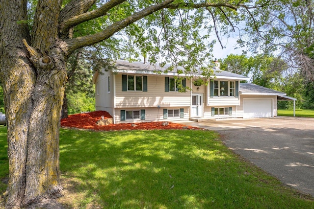 8165 240th St W, Eureka Twp, MN 55044 - bi-level home with asphalt driveway, a garage, and a front yard