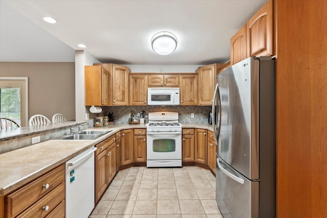 8165 240th St W, Eureka Twp, MN 55044 - kitchen featuring white appliances, a sink, backsplash, light countertops, and recessed lighting