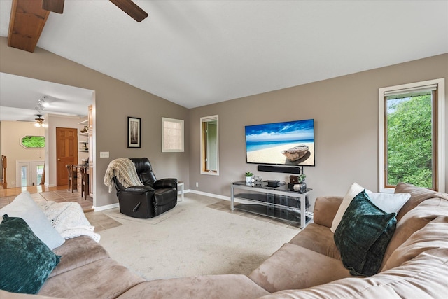 8165 240th St W, Eureka Twp, MN 55044 - living area featuring a ceiling fan, vaulted ceiling, baseboards, and light colored carpet