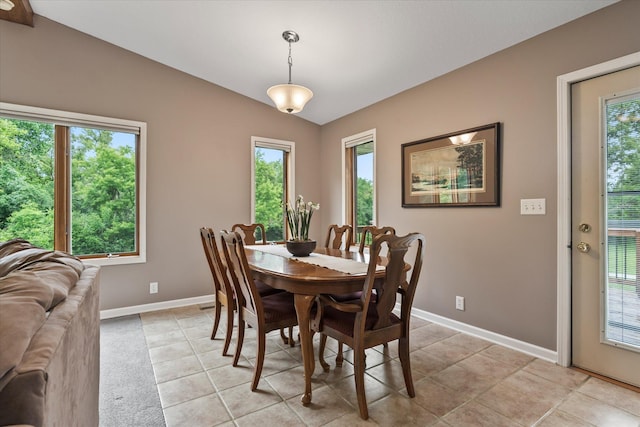 8165 240th St W, Eureka Twp, MN 55044 - dining space with baseboards, plenty of natural light, light tile patterned floors, and lofted ceiling