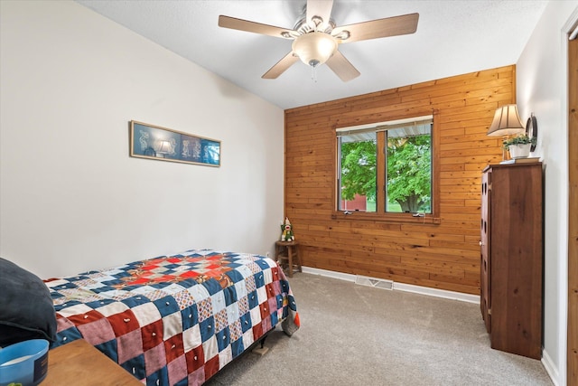 8165 240th St W, Eureka Twp, MN 55044 - bedroom with wood walls, light colored carpet, baseboards, and ceiling fan
