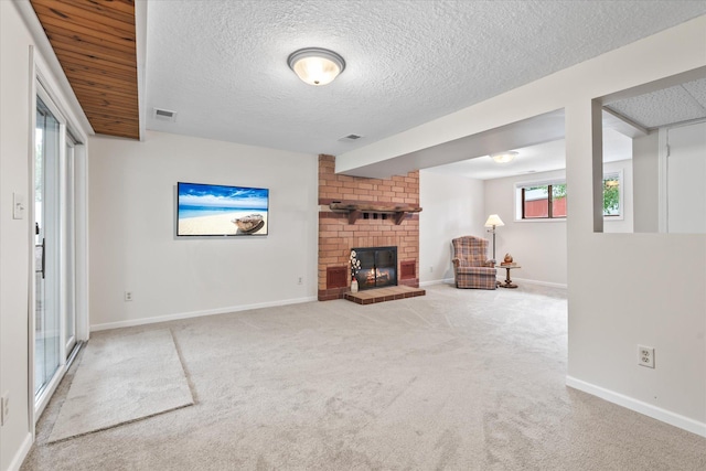 8165 240th St W, Eureka Twp, MN 55044 - unfurnished living room featuring carpet, a fireplace, baseboards, and a textured ceiling