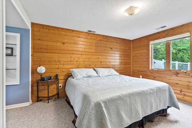 8165 240th St W, Eureka Twp, MN 55044 - bedroom with carpet floors, a textured ceiling, wood walls, and baseboards
