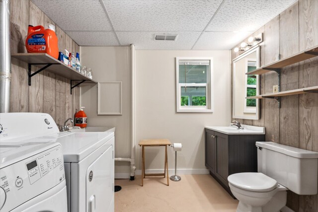 8165 240th St W, Eureka Twp, MN 55044 - washroom featuring washer and dryer and baseboards