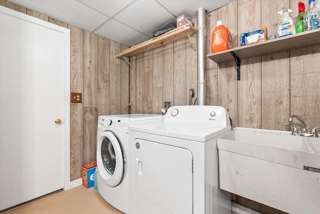 8165 240th St W, Eureka Twp, MN 55044 - laundry room with wood walls and washing machine and clothes dryer