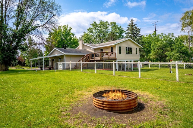 8165 240th St W, Eureka Twp, MN 55044 - back of house with a fire pit, a wooden deck, and a chimney