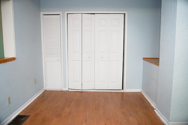 89 Winnipeg Ave, Saint Paul, MN 55117 - unfurnished bedroom with wood finished floors and baseboards