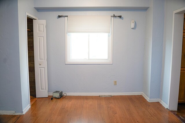 89 Winnipeg Ave, Saint Paul, MN 55117 - unfurnished bedroom featuring wood finished floors and baseboards