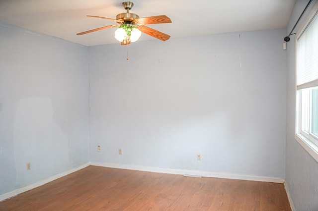 89 Winnipeg Ave, Saint Paul, MN 55117 - spare room featuring wood finished floors, plenty of natural light, a ceiling fan, and baseboards
