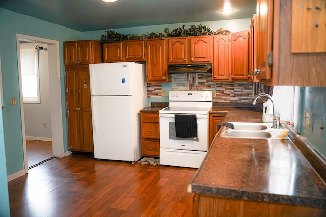 89 Winnipeg Ave, Saint Paul, MN 55117 - kitchen with white appliances, a sink, under cabinet range hood, brown cabinetry, and backsplash