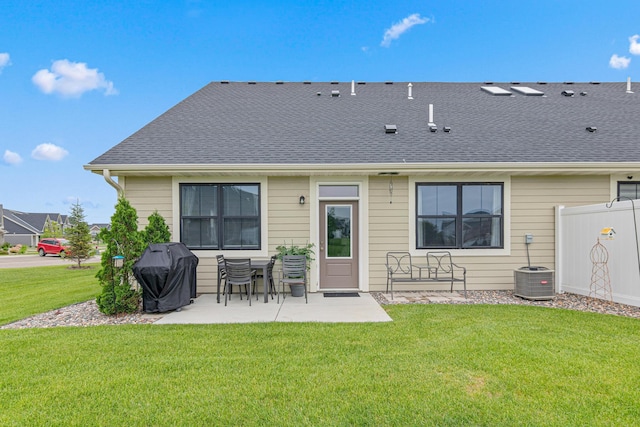 18165 Garland Path, Lakeville, MN 55044 - back of property featuring a patio area, a yard, and a shingled roof
