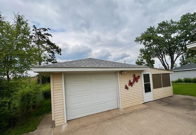 455 113th Ave NW, Coon Rapids, MN 55448 - garage with concrete driveway