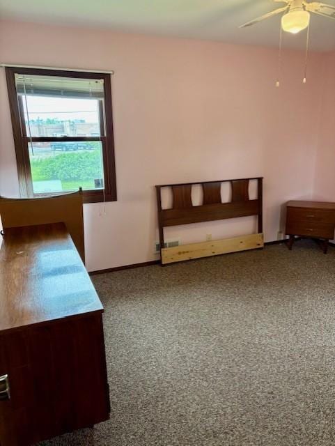 455 113th Ave NW, Coon Rapids, MN 55448 - unfurnished bedroom with ceiling fan, baseboards, and carpet flooring