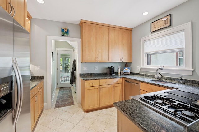 3229 Fremont Ave S, Minneapolis, MN 55408 - kitchen featuring appliances with stainless steel finishes, a sink, healthy amount of natural light, dark stone countertops, and recessed lighting