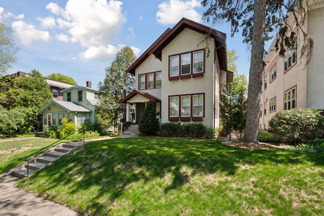 3229 Fremont Ave S, Minneapolis, MN 55408 - view of front of property featuring stucco siding and a front yard