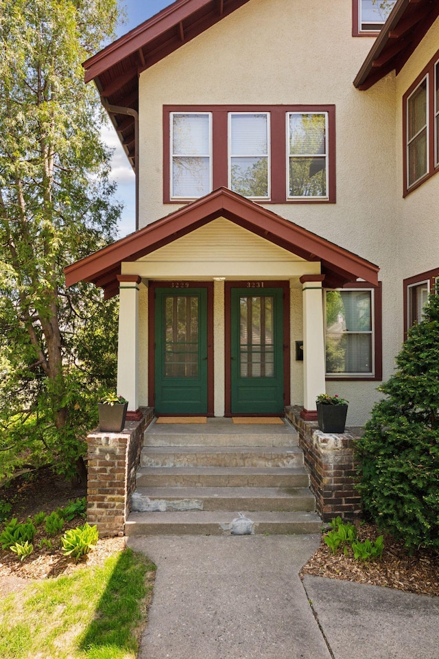 3229 Fremont Ave S, Minneapolis, MN 55408 - property entrance featuring stucco siding and a porch