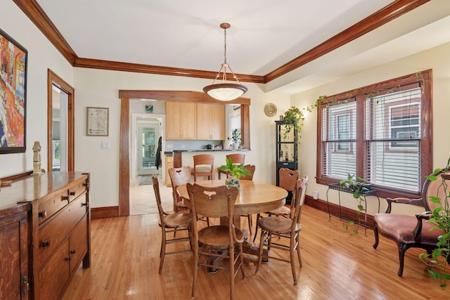 3229 Fremont Ave S, Minneapolis, MN 55408 - dining space featuring baseboards, crown molding, plenty of natural light, and light wood finished floors