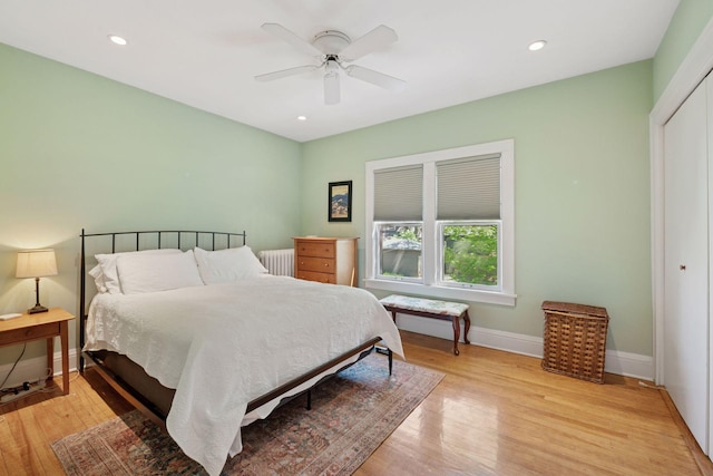 3229 Fremont Ave S, Minneapolis, MN 55408 - bedroom featuring radiator heating unit, light wood-type flooring, baseboards, ceiling fan, and recessed lighting