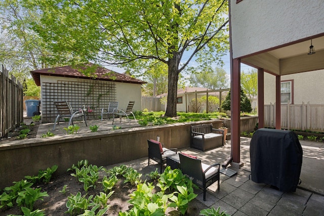 3229 Fremont Ave S, Minneapolis, MN 55408 - fenced backyard with a patio area and an outdoor living space