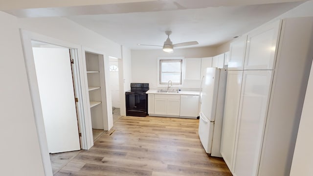 112 2nd St, Kiester, MN 56051 - kitchen featuring white appliances, white cabinets, a ceiling fan, light wood-type flooring, and light countertops