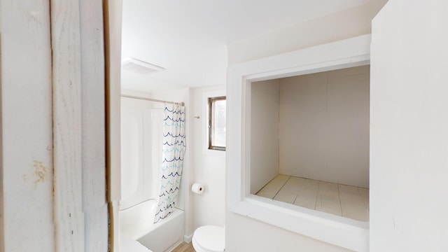 112 2nd St, Kiester, MN 56051 - bathroom featuring toilet and shower / bath combo with shower curtain