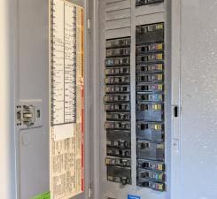 112 2nd St, Kiester, MN 56051 - utility room featuring electric panel