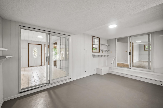 8235 Nicollet Ave S, Bloomington, MN 55420 - empty room with a textured ceiling, concrete floors, and recessed lighting