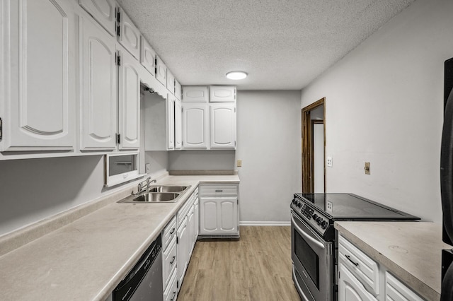 8235 Nicollet Ave S, Bloomington, MN 55420 - kitchen with electric stove, dishwasher, a sink, white cabinetry, and light wood-style flooring